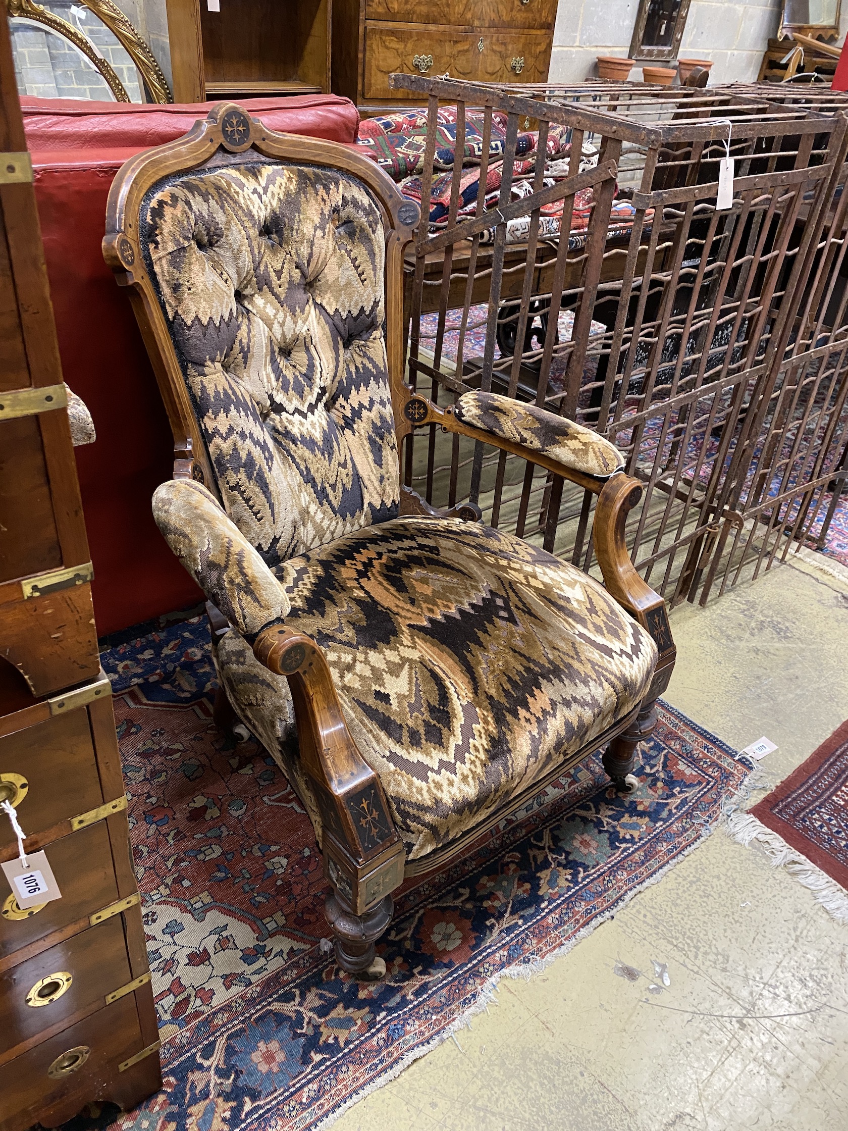 A late Victorian inlaid walnut open armchair, width 73cm, depth 56cm, height 102cm